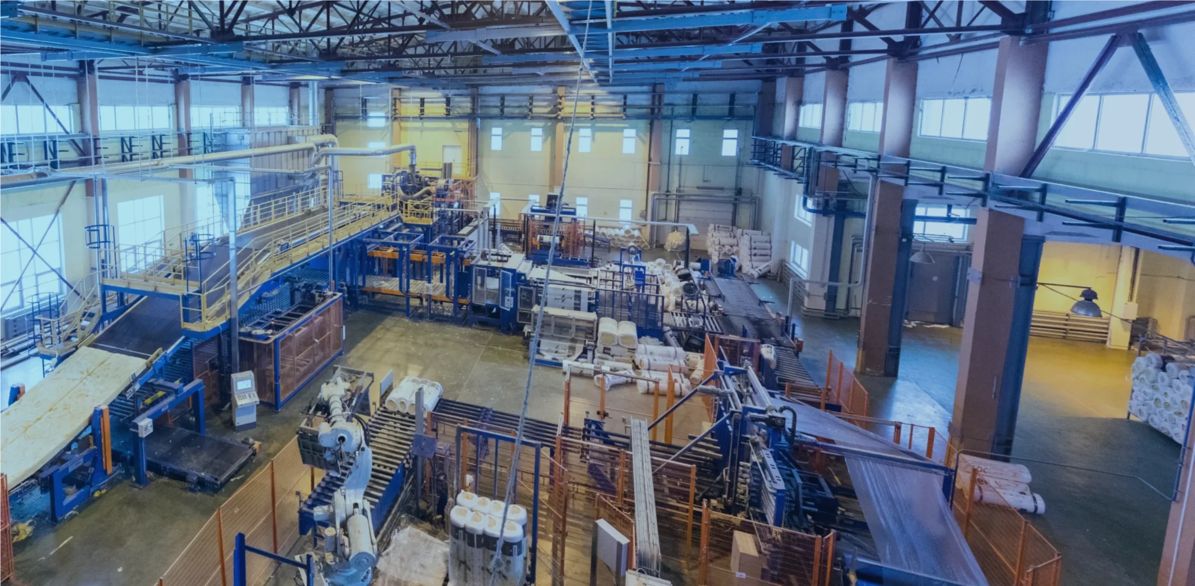 Factory production floor with industrial machinery — smart manufacturing monitoring with S2RE